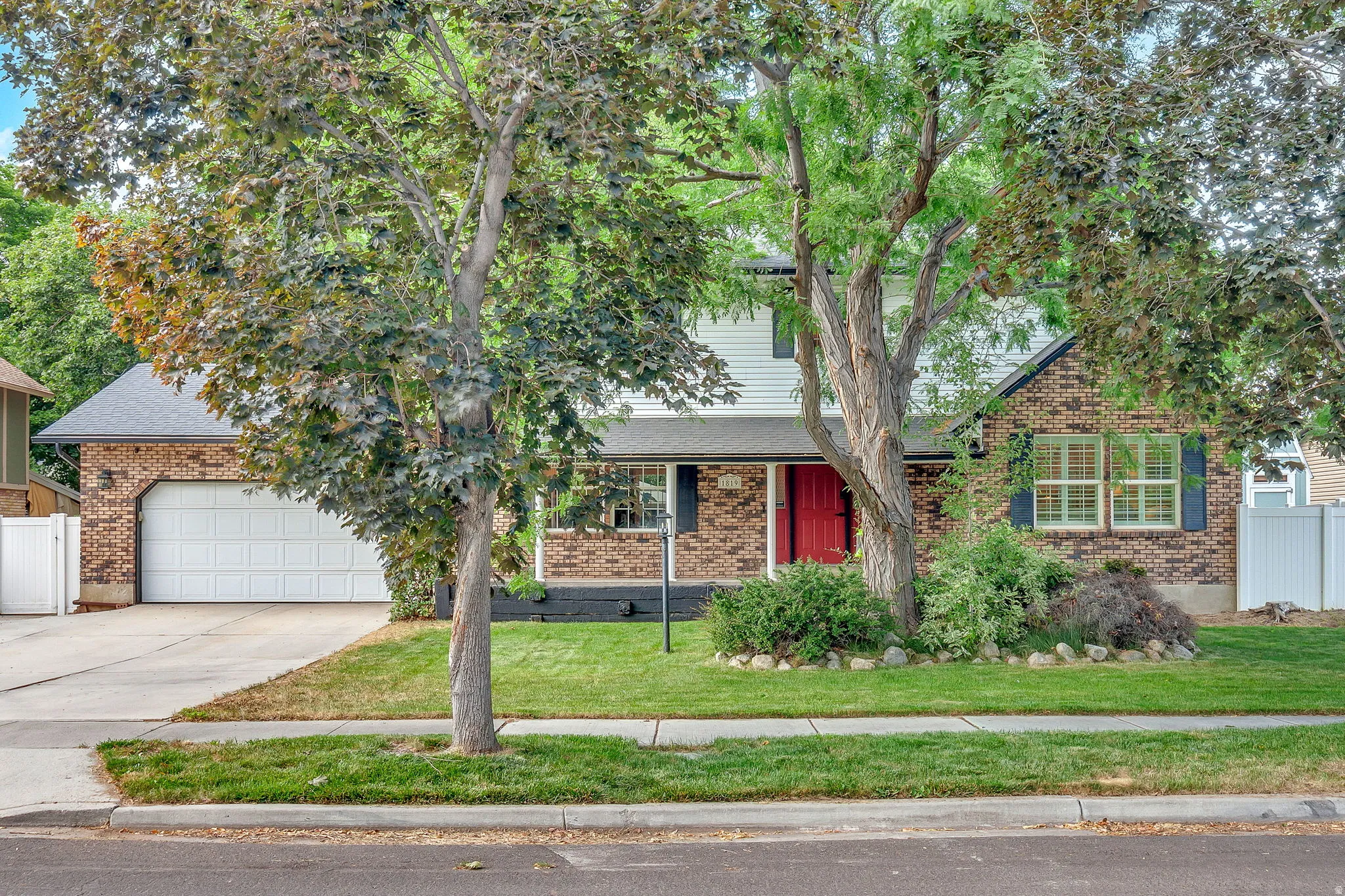 Traditional brick-and-siding exterior with an attached two-car garage