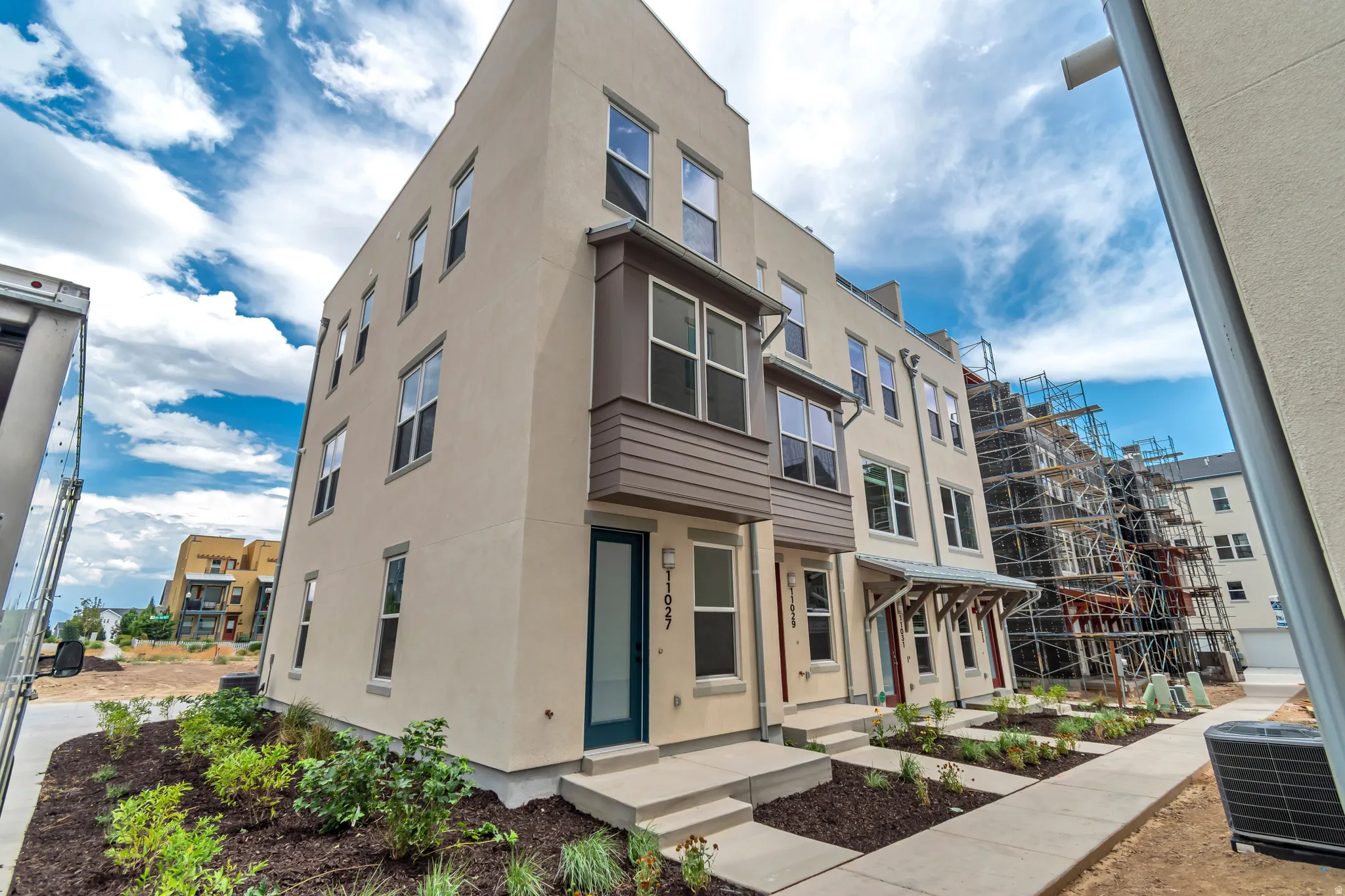 Contemporary multi-story exterior with stucco finish
