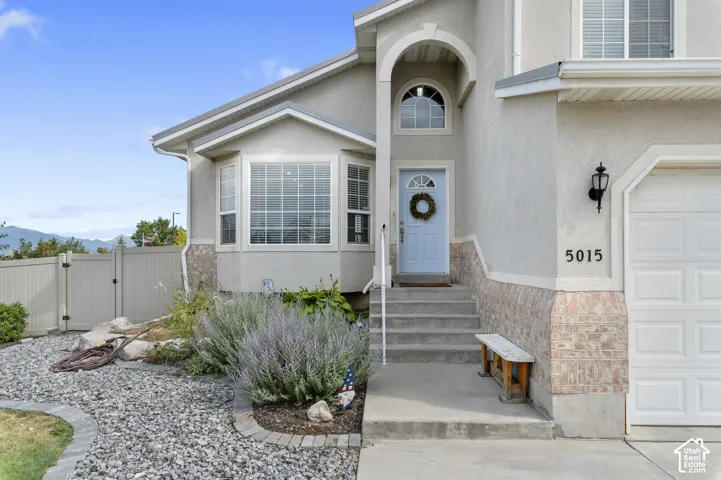 Stucco exterior with stone veneer accents