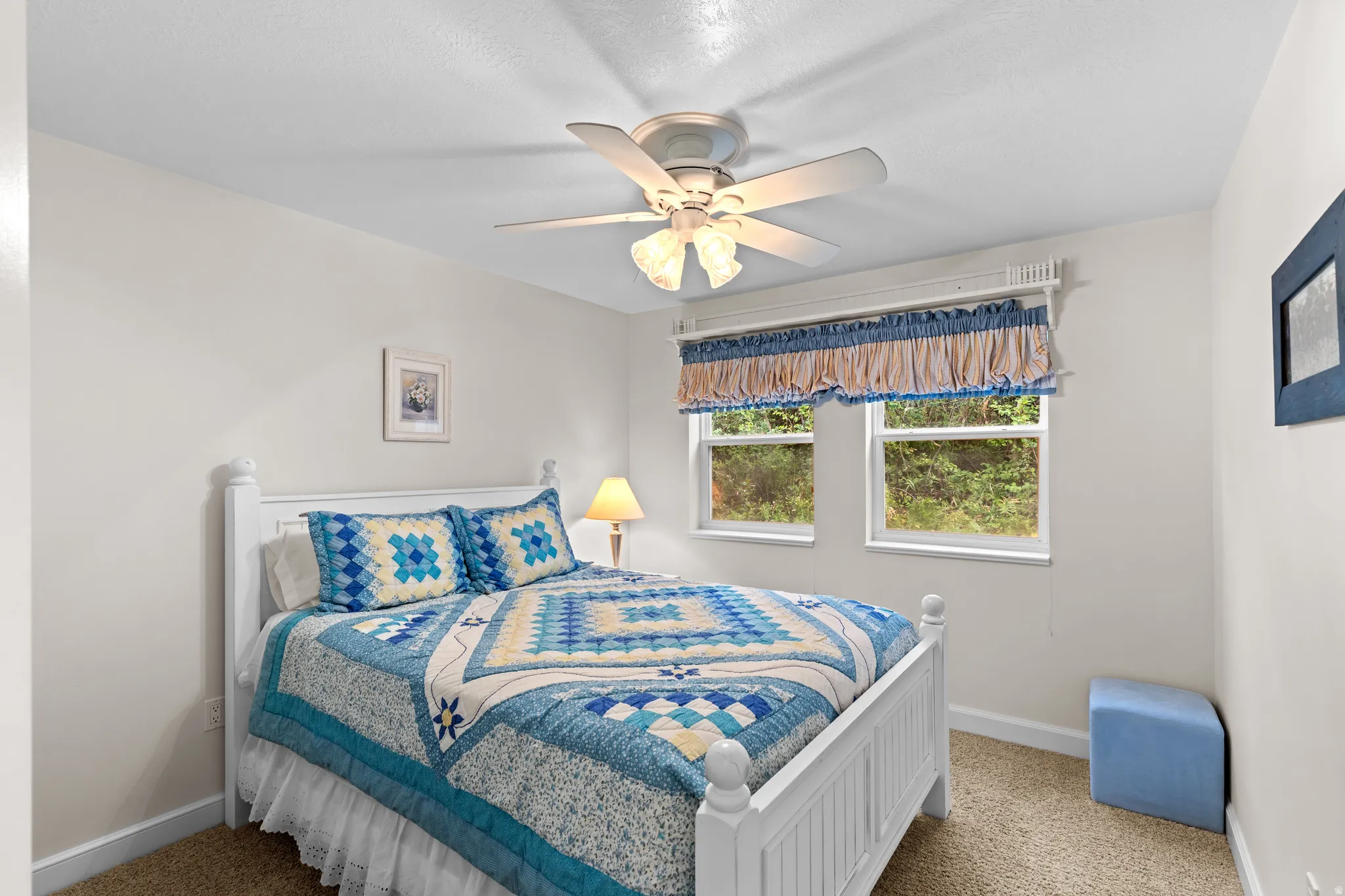 White wall finishes complement a neutral carpeted floor
