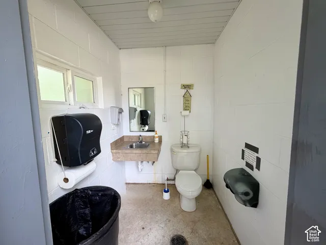 White block wall construction with a built-in vanity sink and mirror