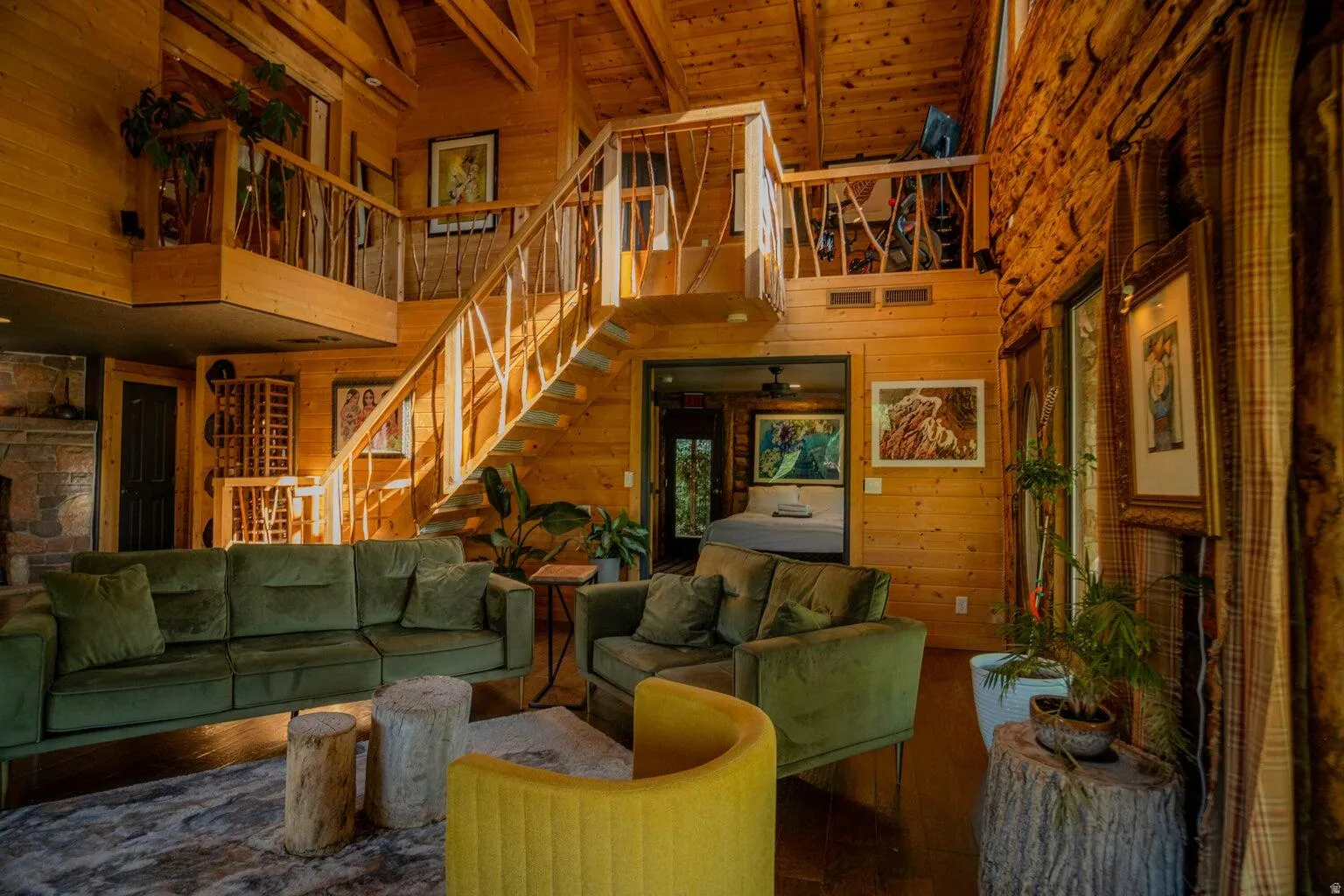 Expansive interior featuring wood-paneled walls and ceiling with exposed beams