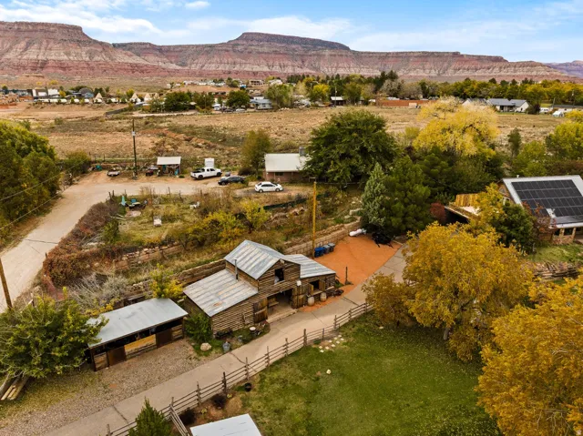 Rustic property featuring multiple structures with metal roofs