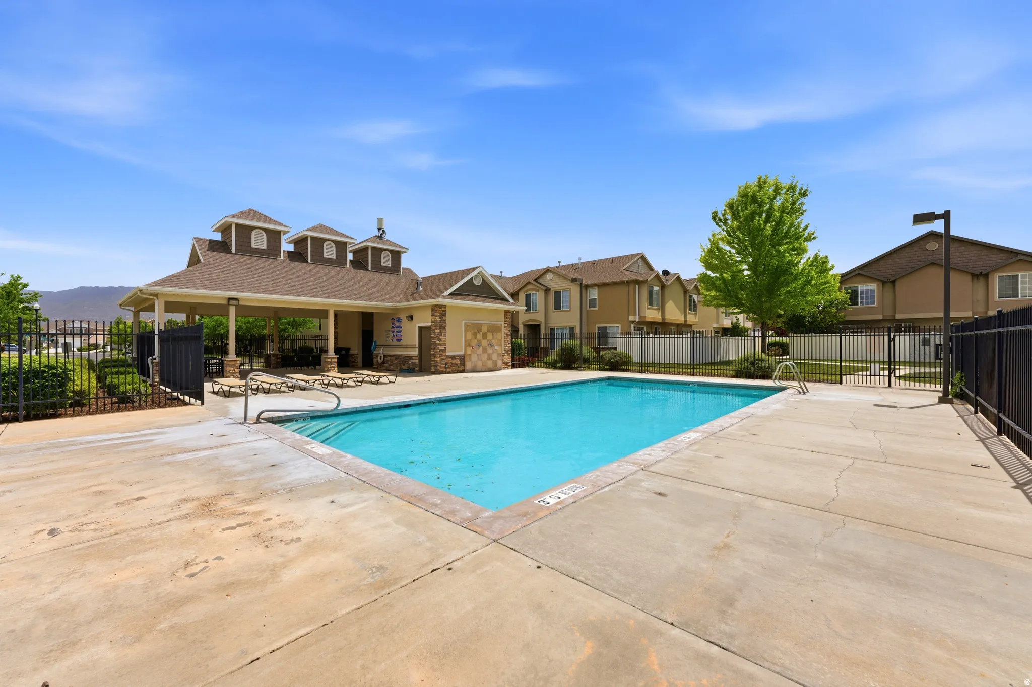 Outdoor swimming pool with concrete decking
