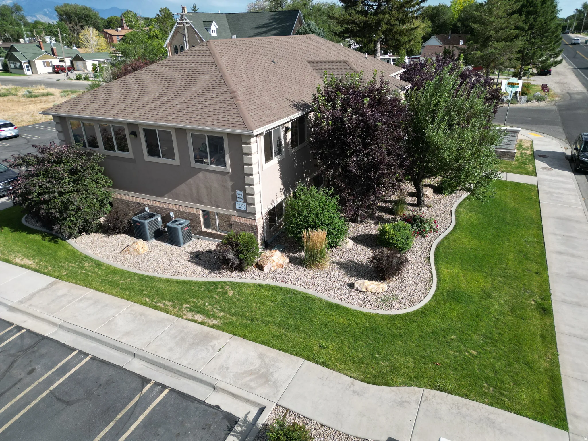 Commercial property featuring a stucco exterior with decorative corner trim