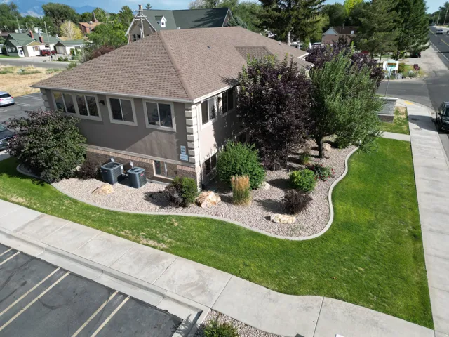 Commercial property featuring a stucco exterior with decorative corner trim