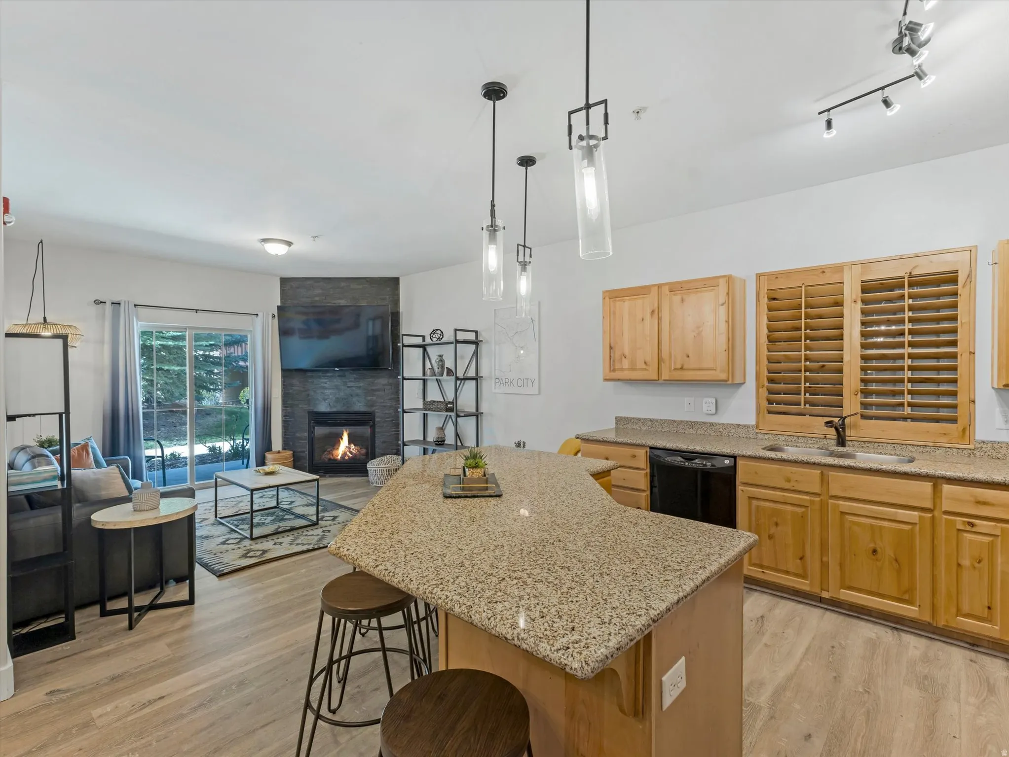 Kitchen island with a granite-style countertop and seating