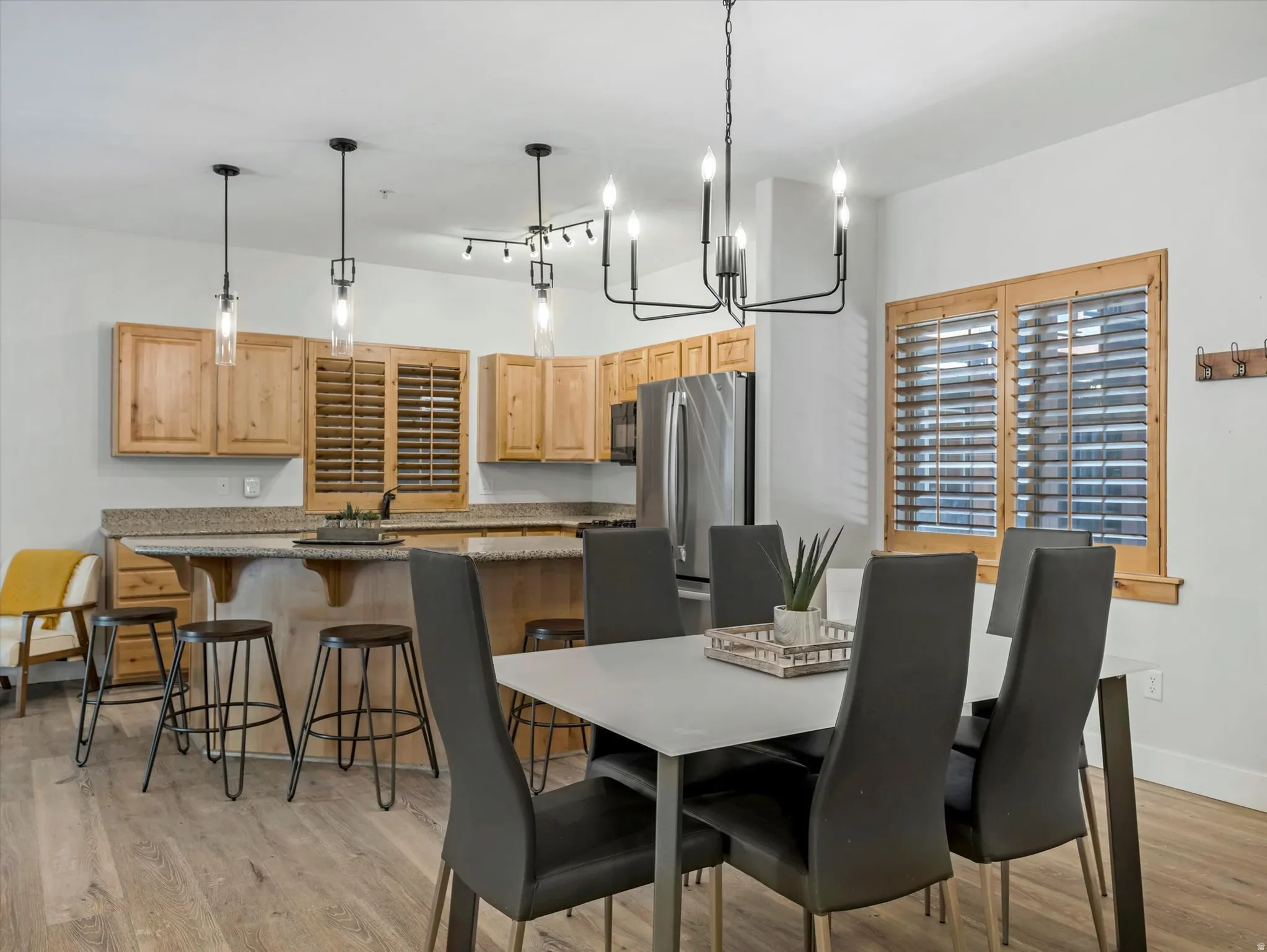 Open-concept living space featuring wood-finish flooring