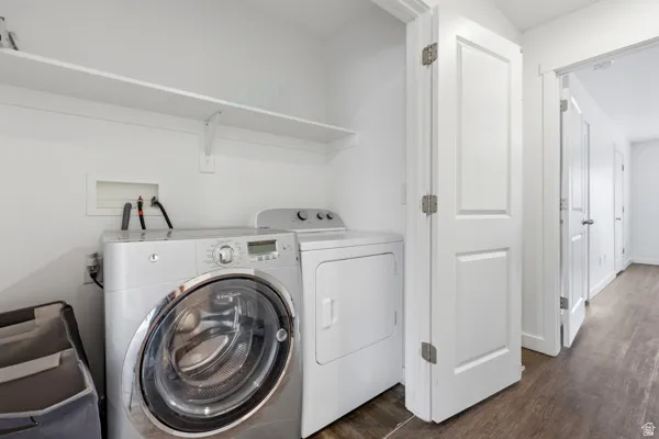Dedicated laundry area featuring a shelf and hard-surface flooring