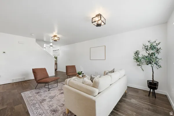 Living space featuring wood-finish flooring and a neutral color palette