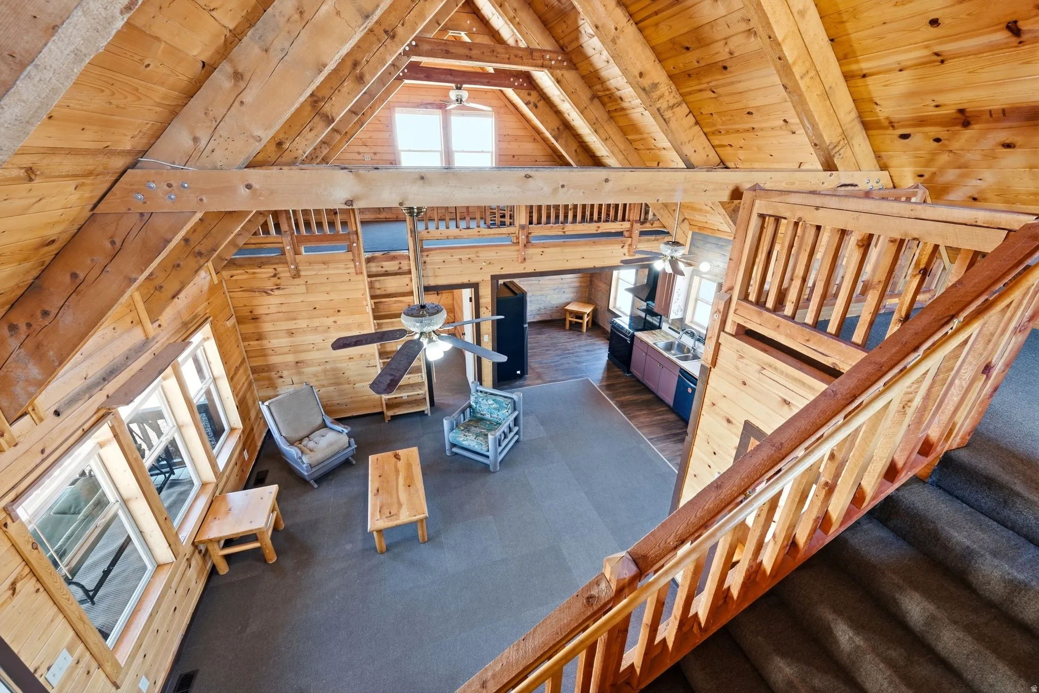 Vaulted wood-paneled ceilings with exposed beams and loft space