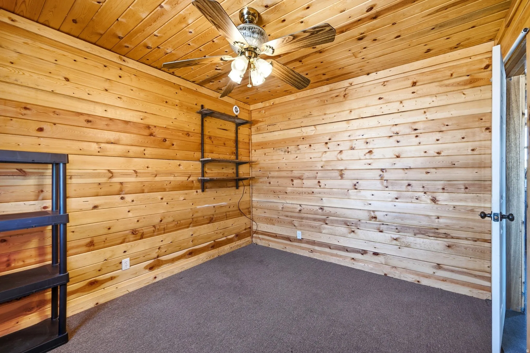 Wood-paneled room with matching wood-paneled ceiling