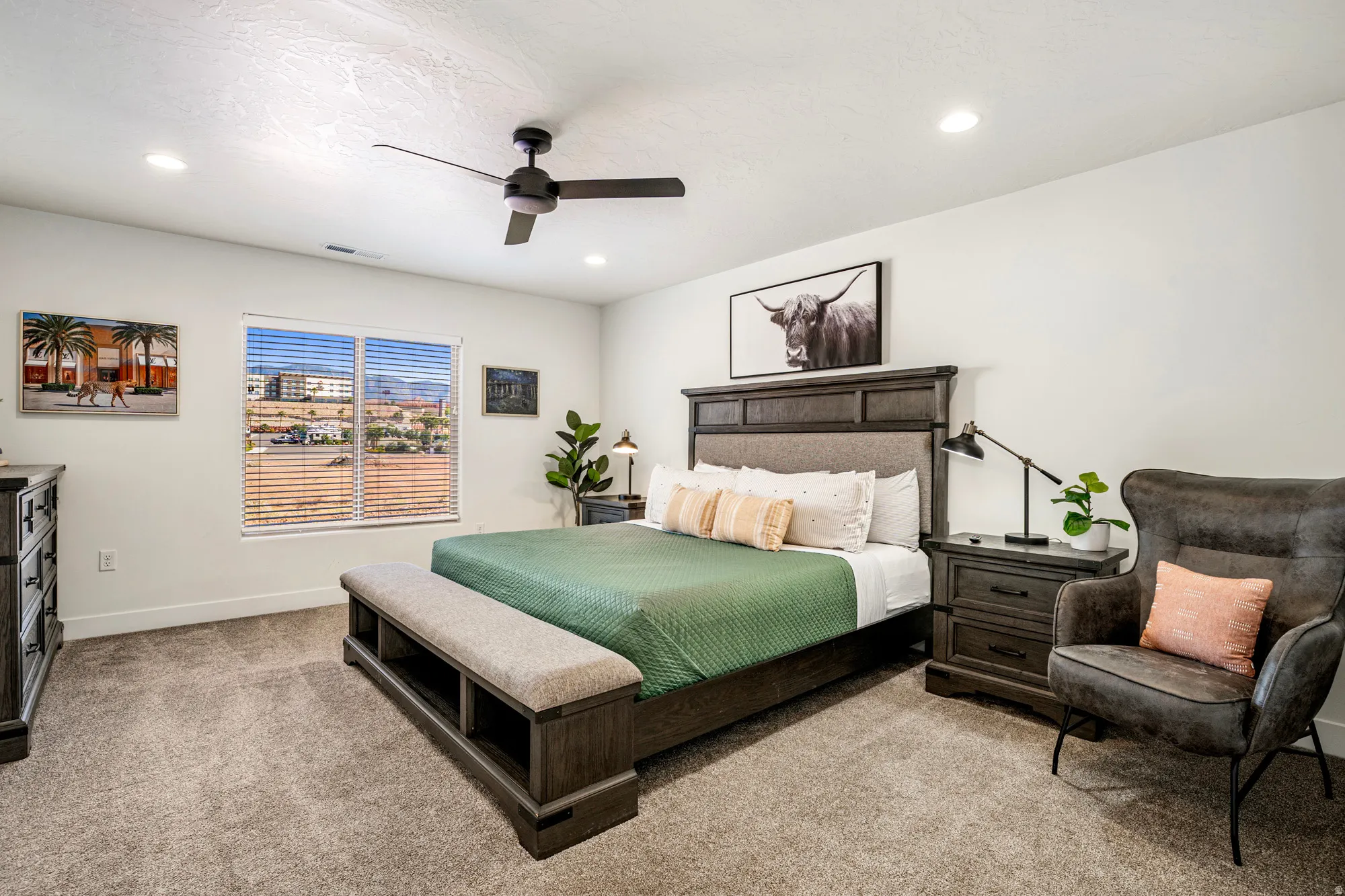 Spacious bedroom featuring neutral carpeting, recessed lighting, and a modern ceiling fan