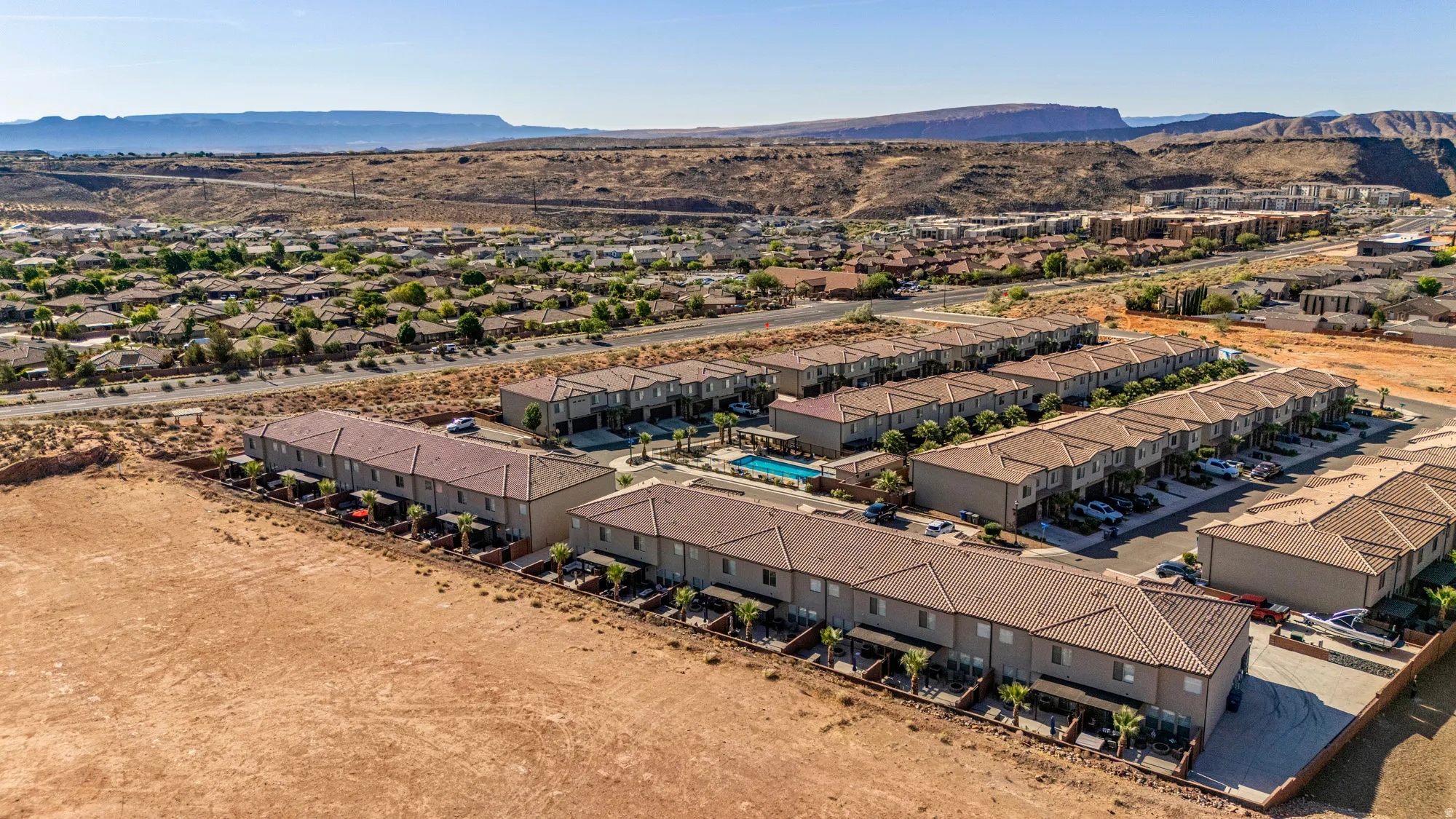 Residential community featuring multiple two-story buildings with tile roofs