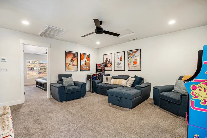 Carpeted room with recessed lighting and a ceiling fan