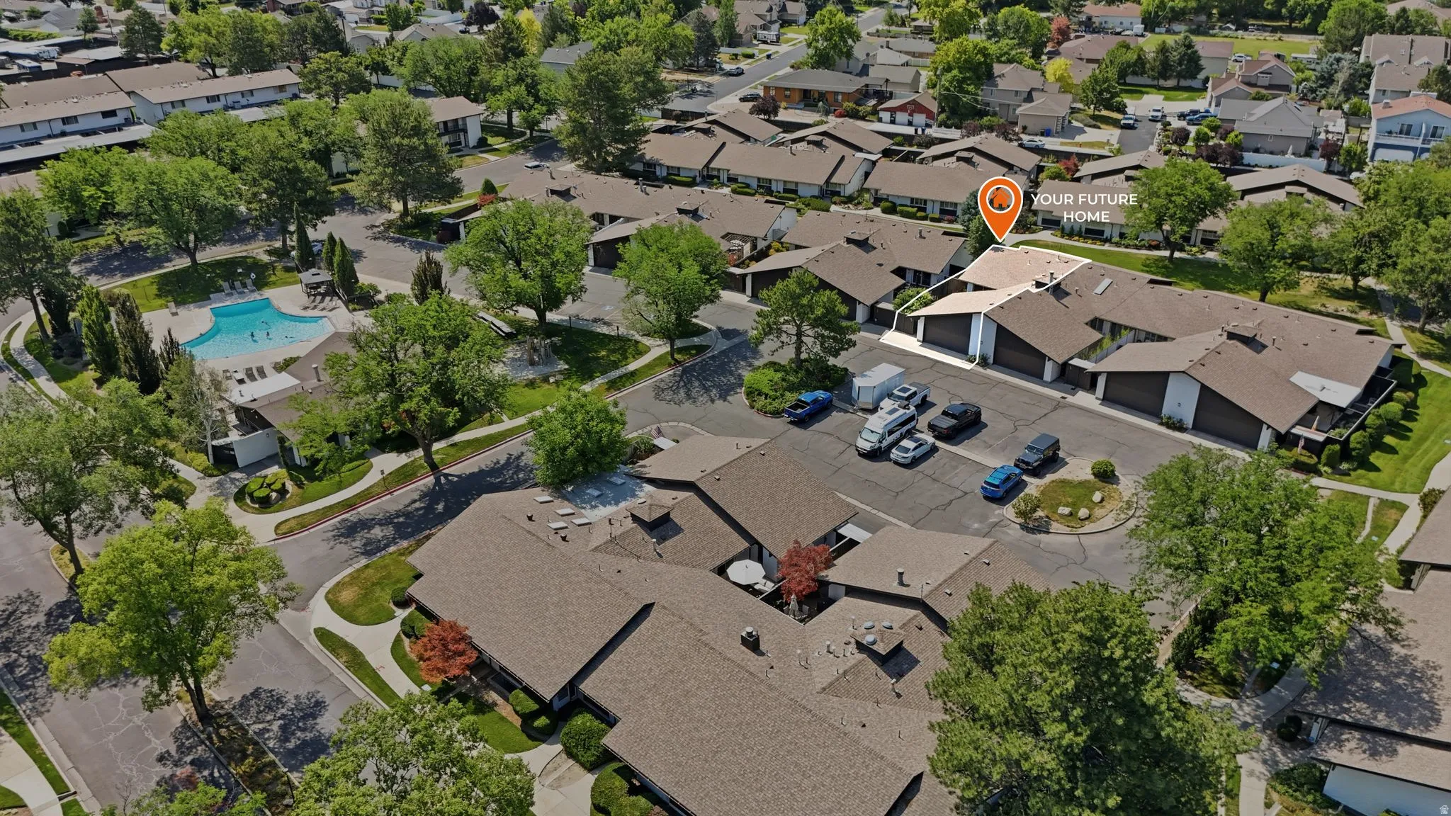 Aerial perspective highlighting a multi-unit property with ample parking