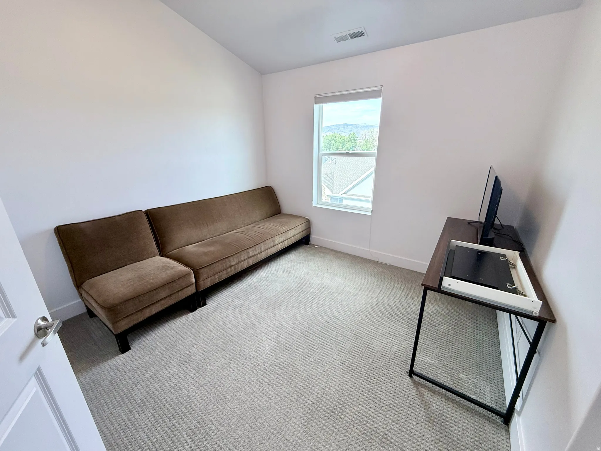 Bedroom #2: Carpeted room featuring a single window, white walls, and white trim