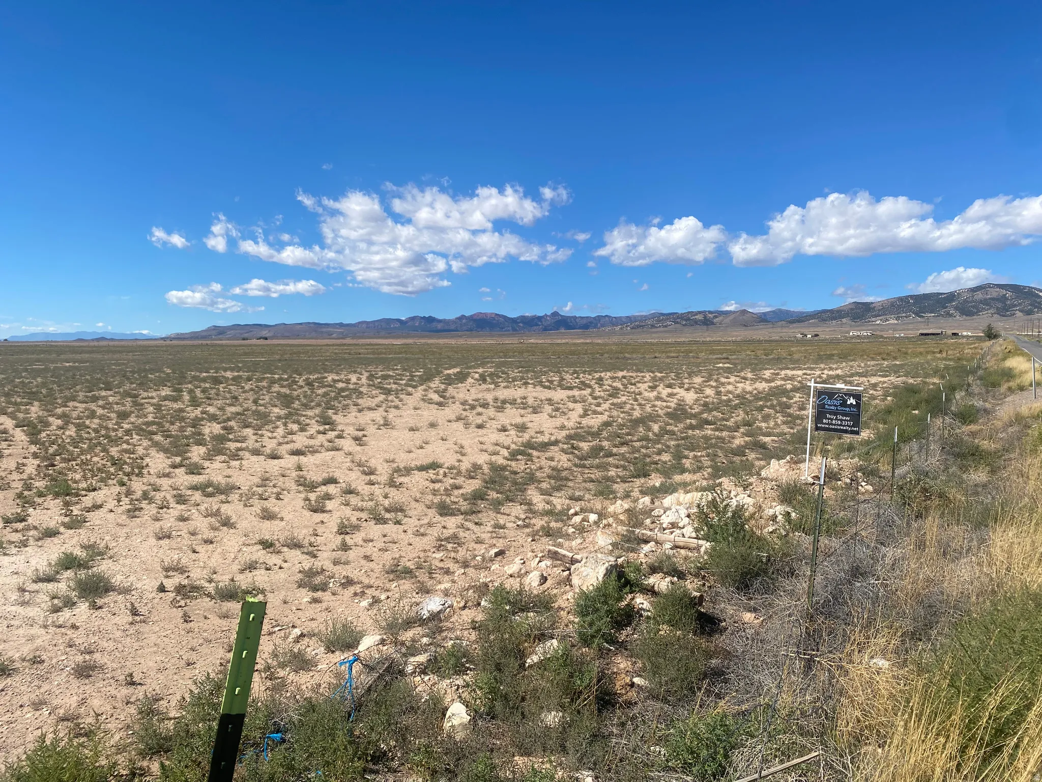 Expansive undeveloped land with a distant mountain backdrop