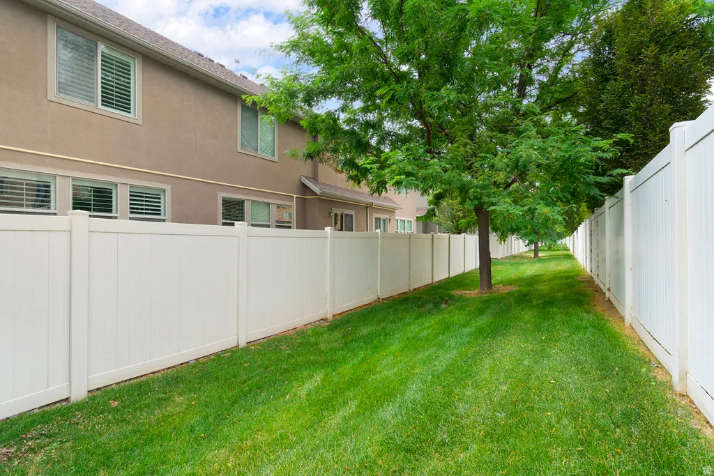 Grassy Area behind fence in back