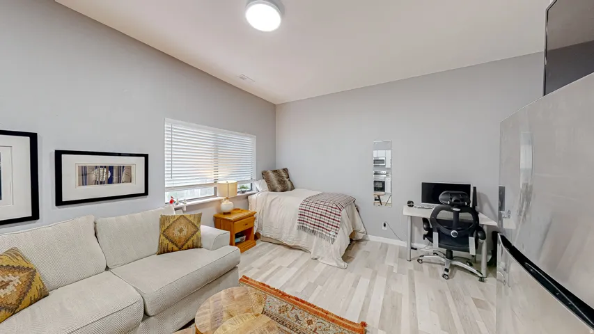 Bright interior space featuring light-toned wood-finish flooring