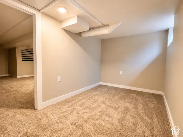 Bedroom with beige walls and white trim