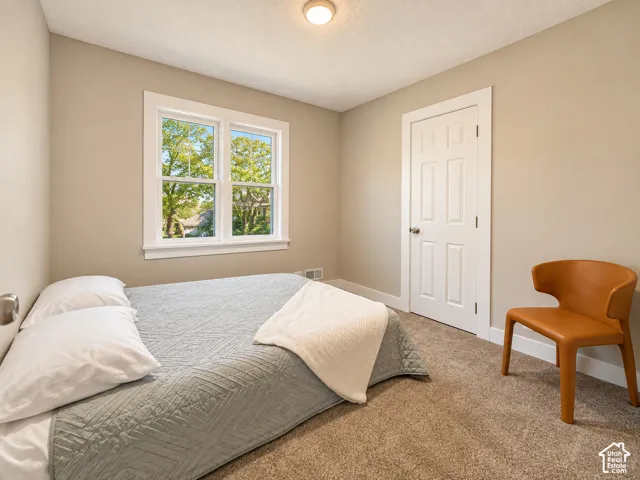 Neutral wall paint and carpeted flooring