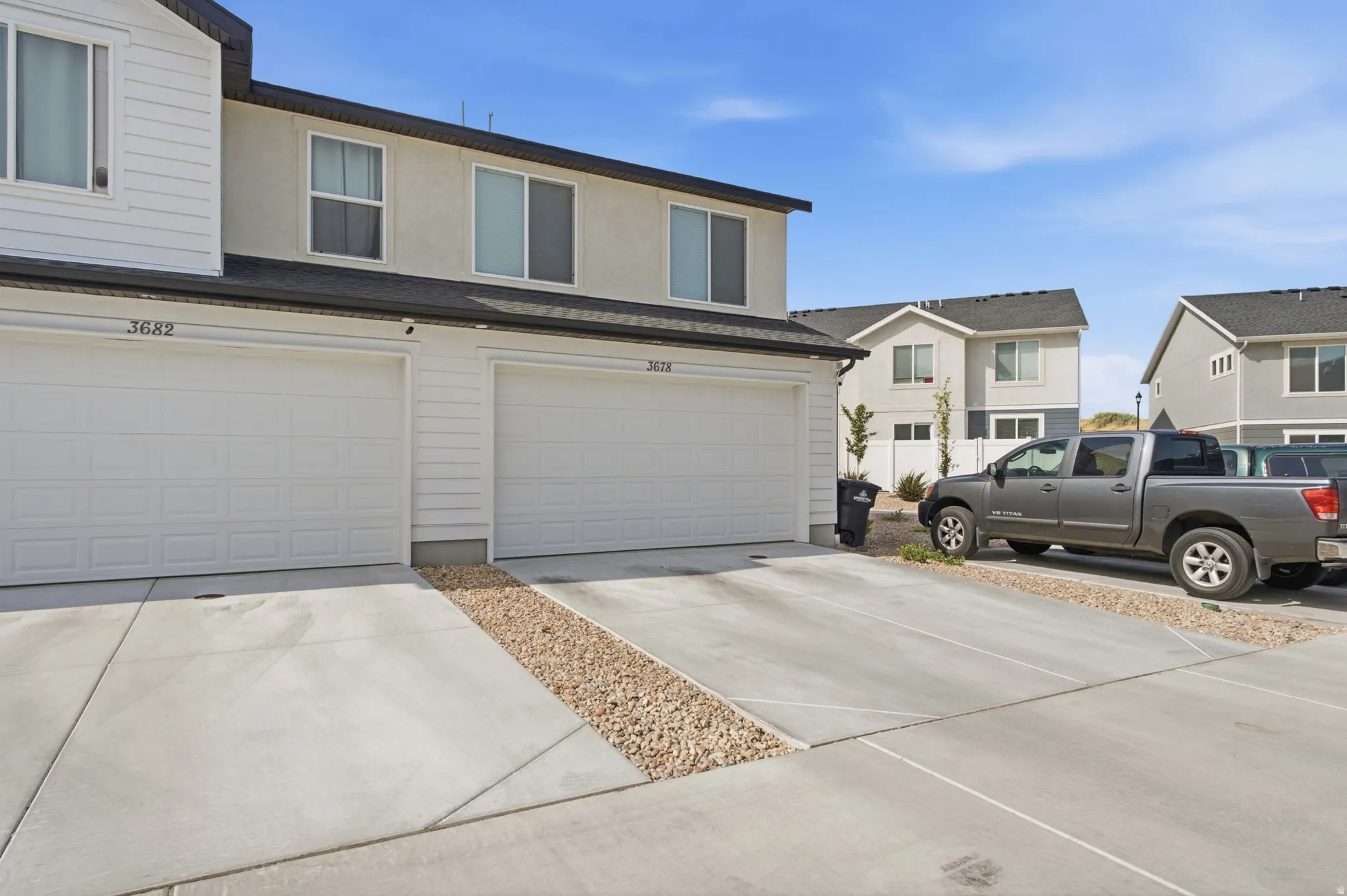 Concrete driveway providing access to two distinct garage entrances