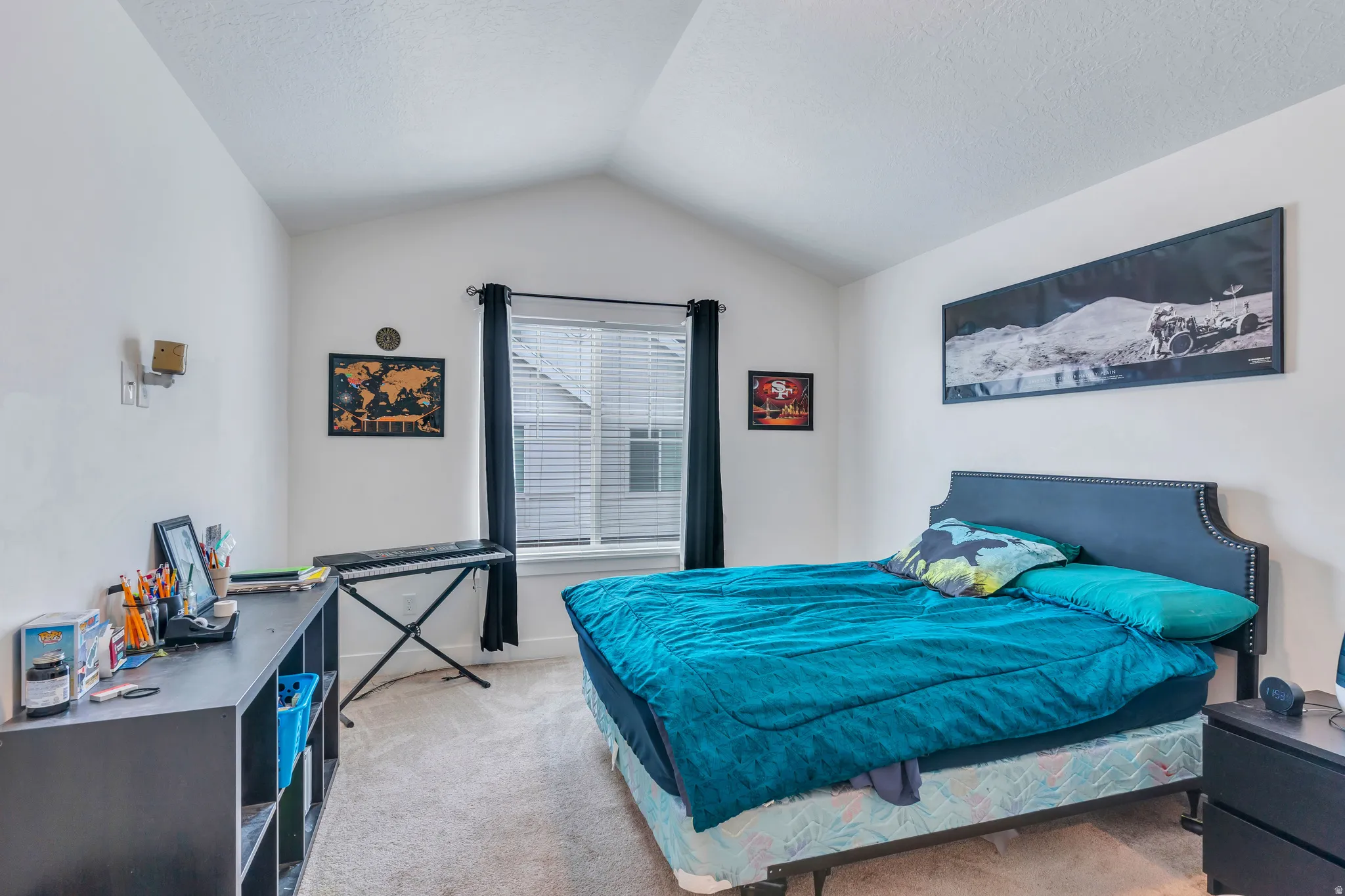 Vaulted ceiling bedroom featuring a carpeted floor, window with blinds, and recessed lighting