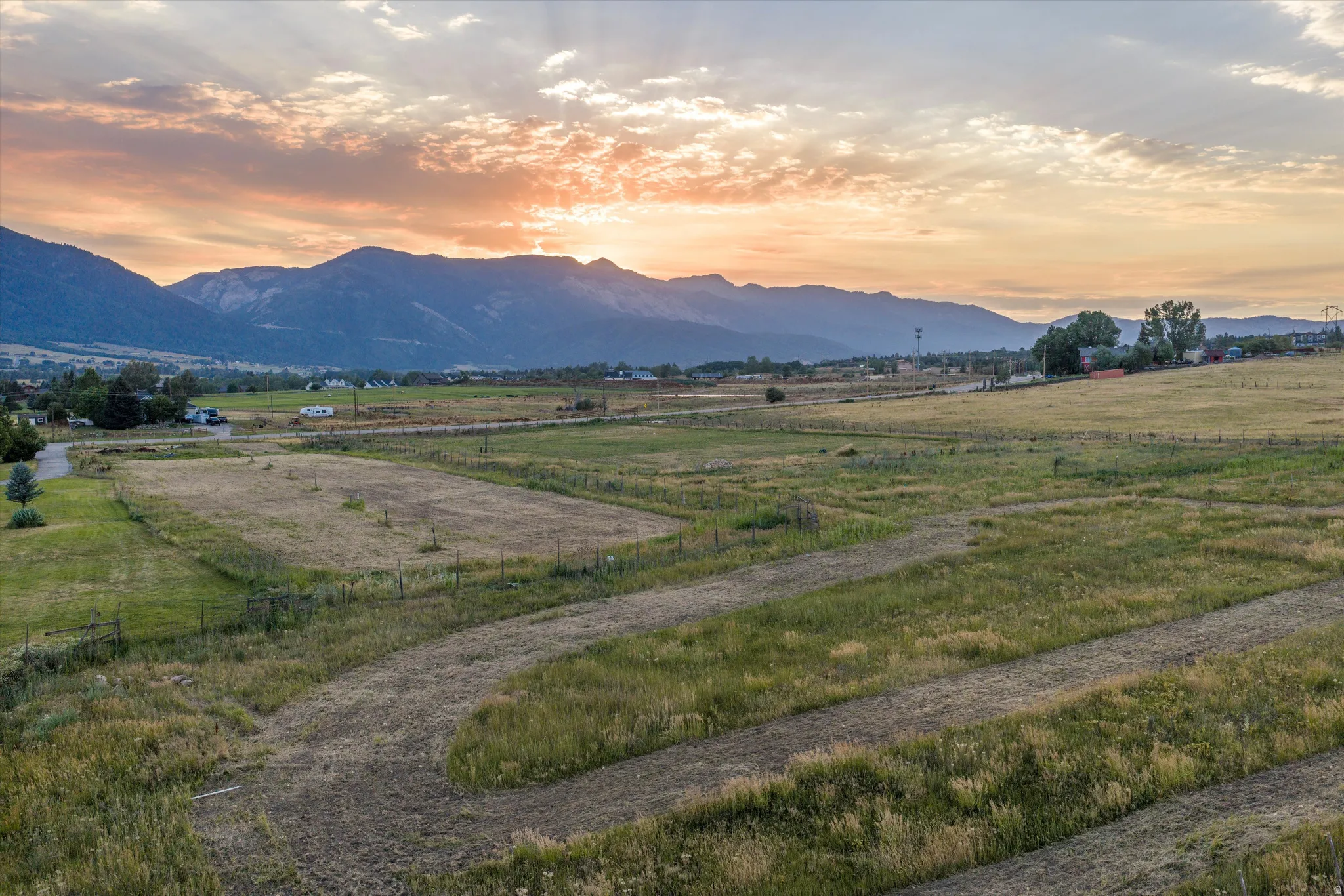 Expansive land parcel featuring diverse topography and distant mountain range