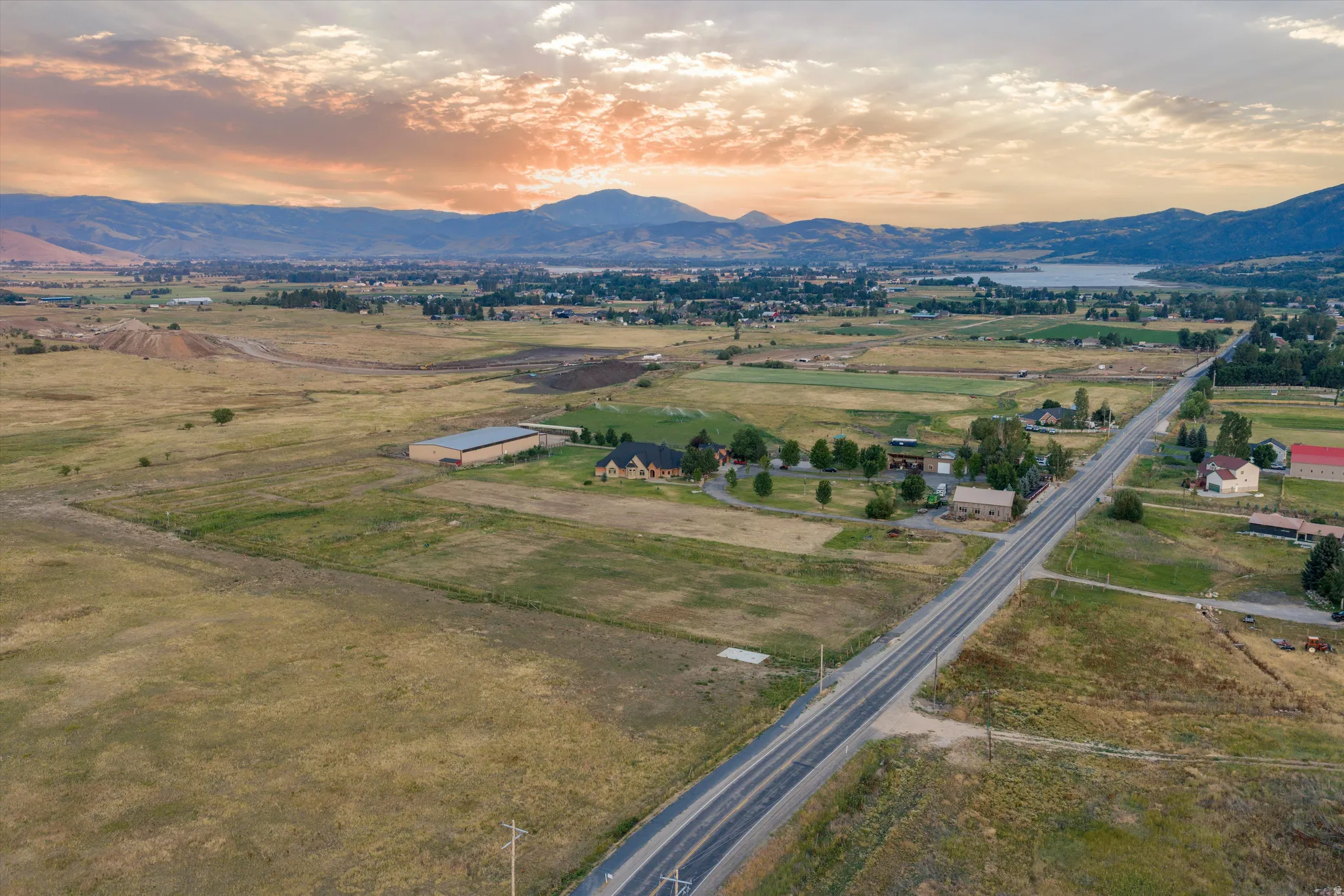 Expansive landscape featuring distant mountains and a lake