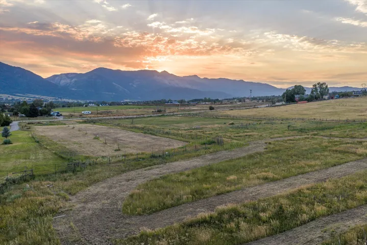 Expansive land parcel featuring diverse topography and distant mountain range