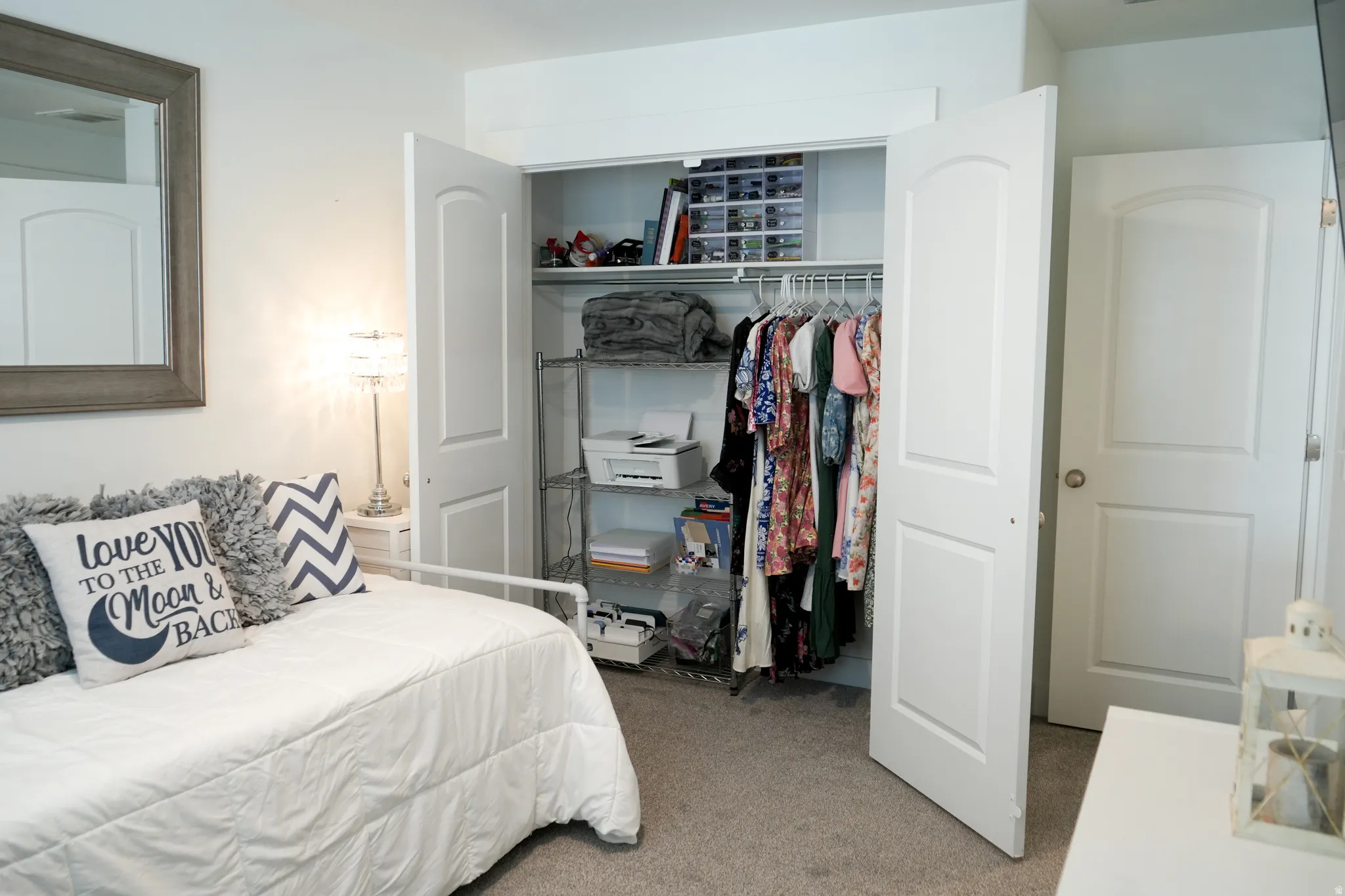Bedroom with neutral carpet flooring