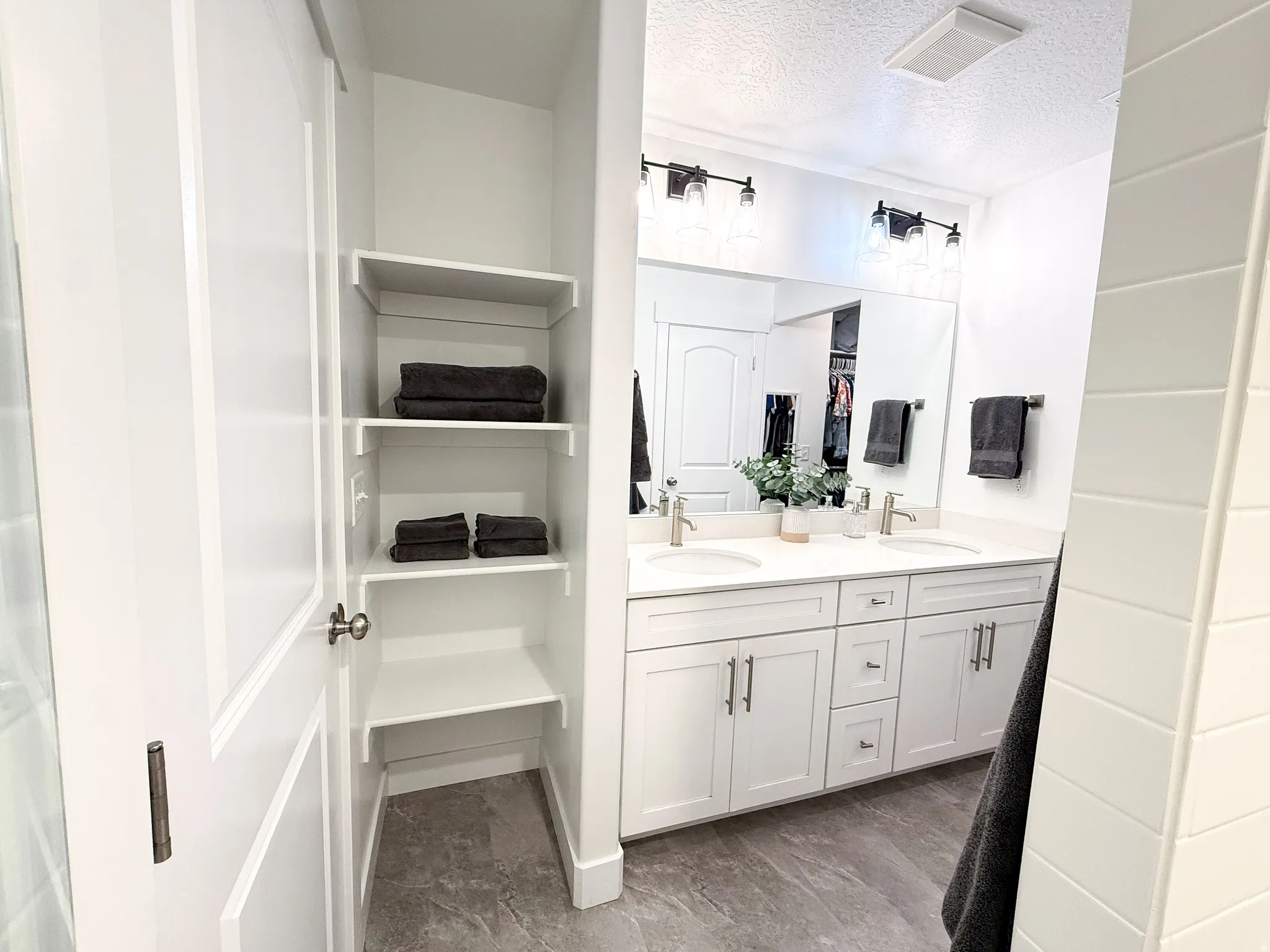 Dual vanity with undermount sinks and chrome fixtures