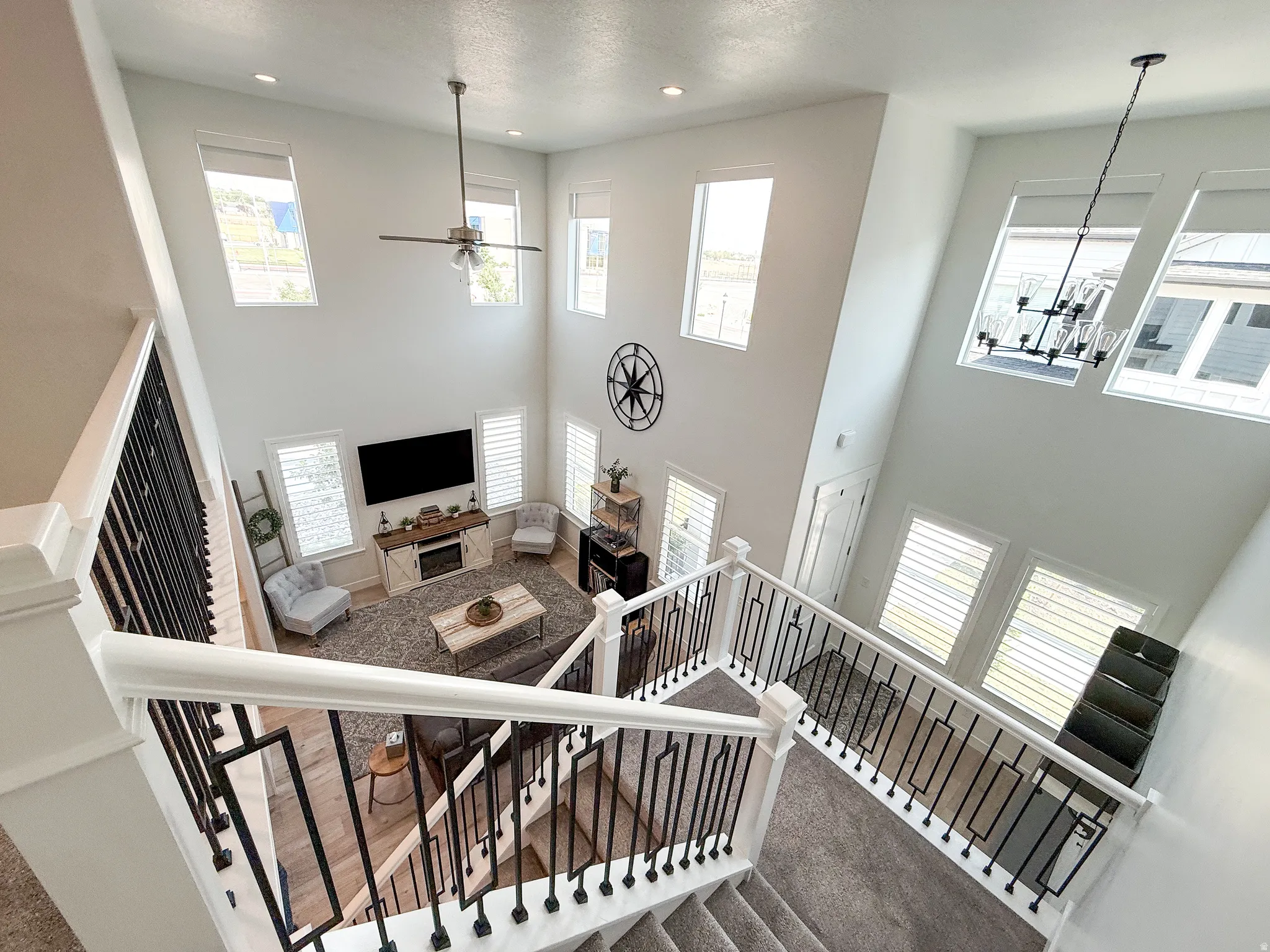 Two-story living area featuring a vaulted ceiling and an open-concept layout