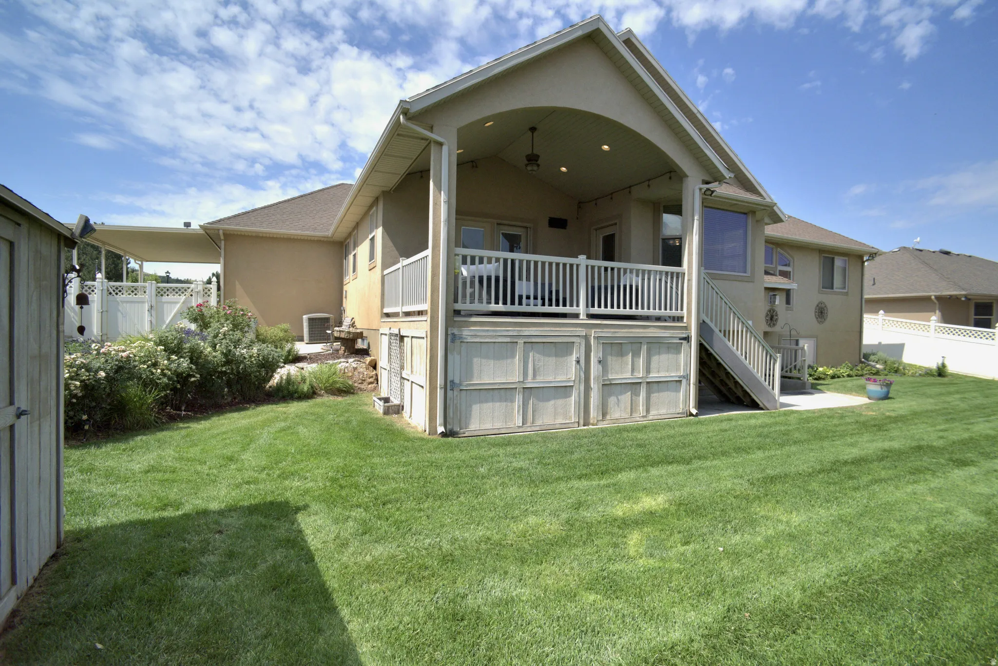 COVERED BACK DECK WITH STORAGE AREA BENEATH
