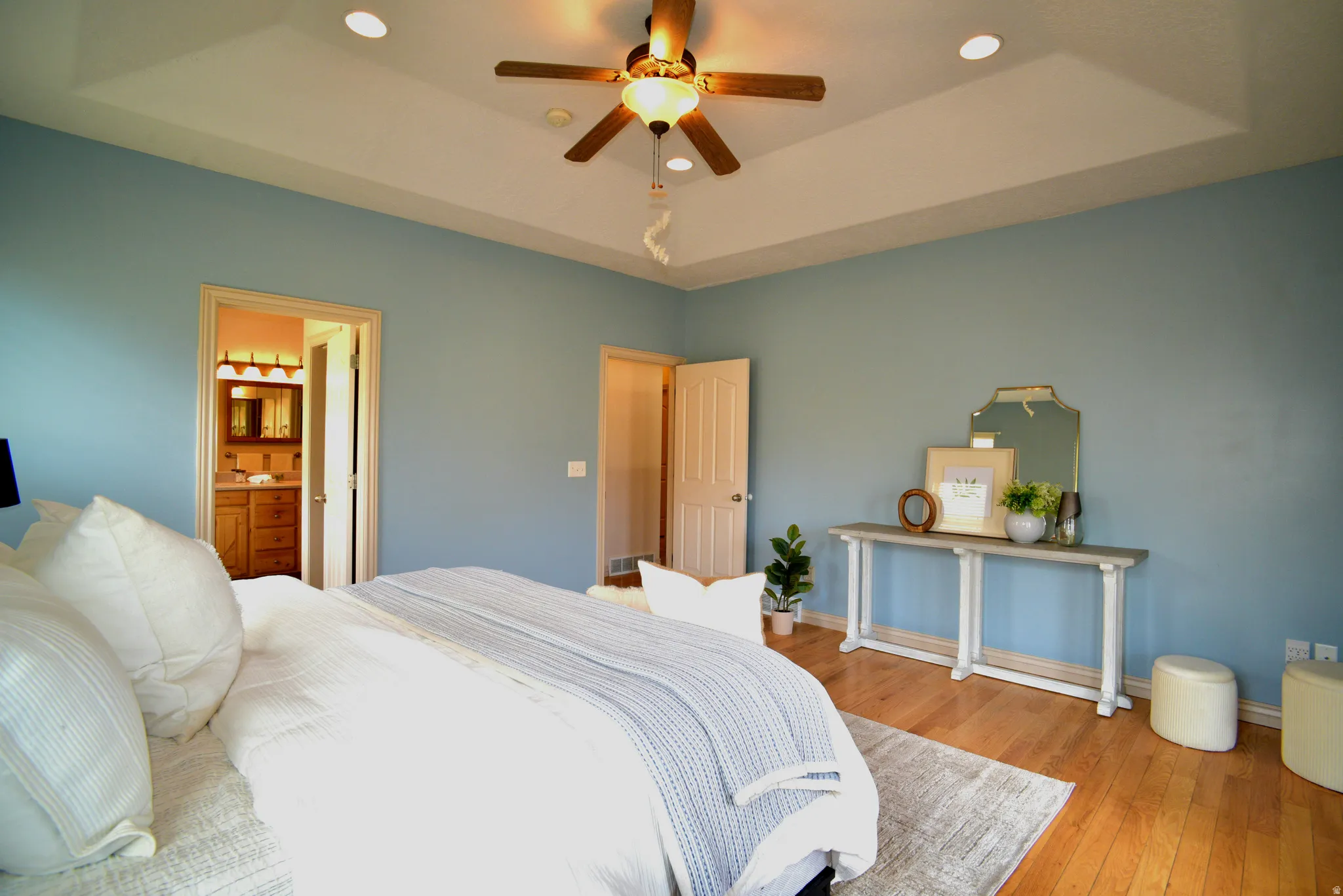 PRIMARY BEDROOM WITH CUSTOM TRAY CEILINGS