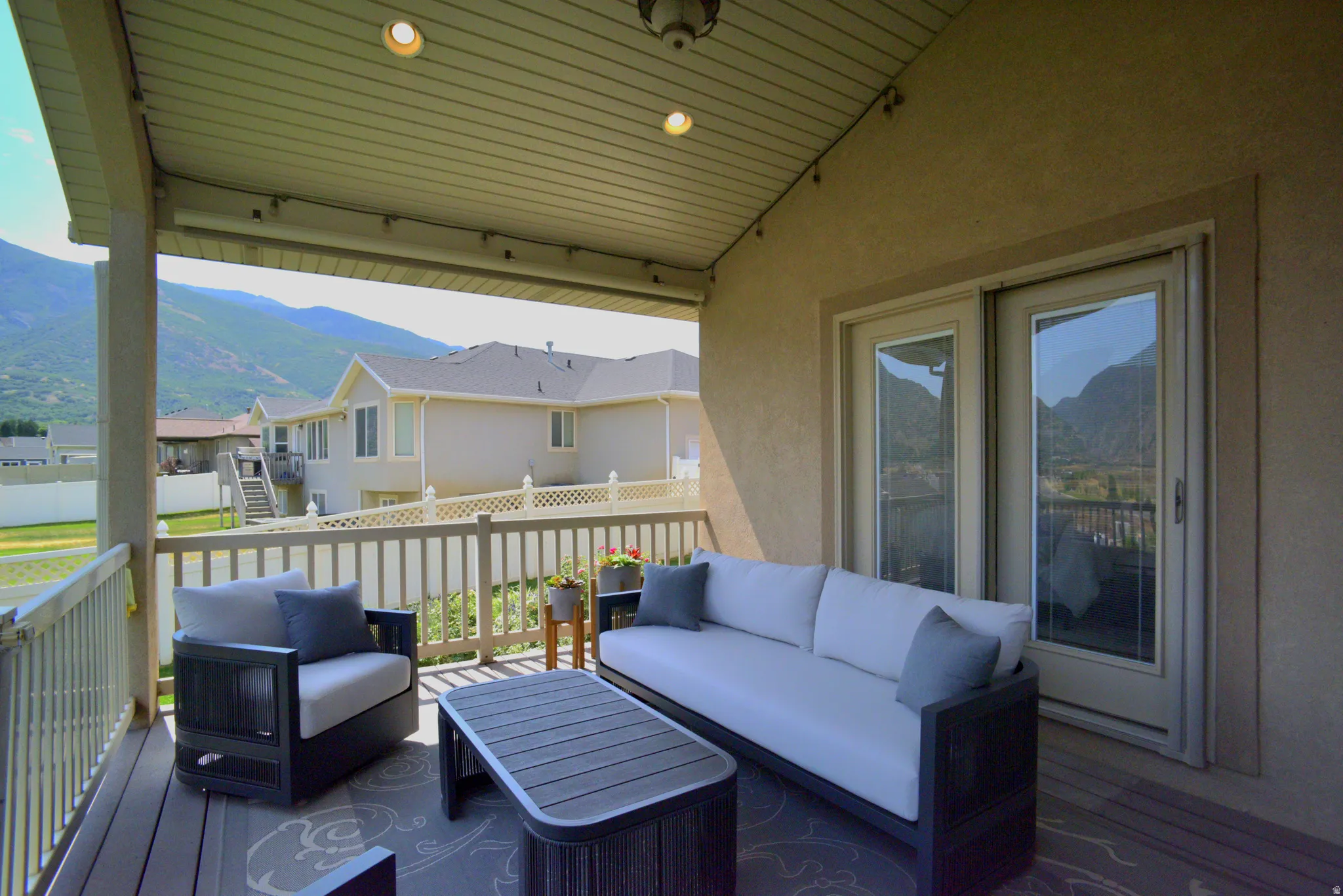 LOVELY COVERED PATIO WITH EDISON LIGHTS TO ENJOY YOUR BEAUTIFUL EVENING VIEWS!