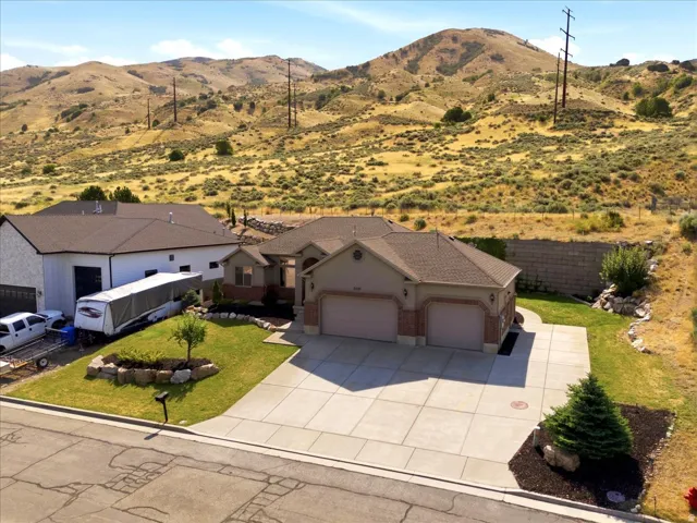 Ranch-style residence featuring a prominent two-car garage