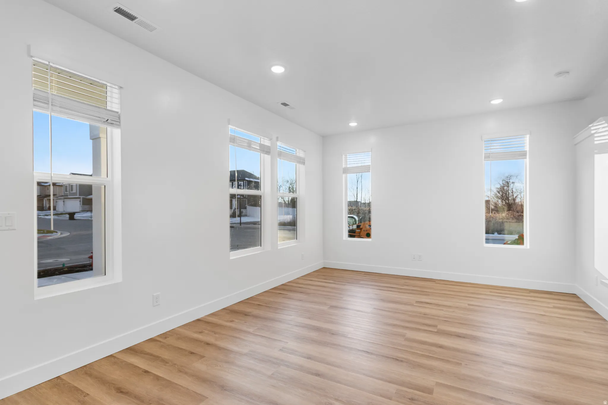 Bright interior space featuring light wood-finish flooring