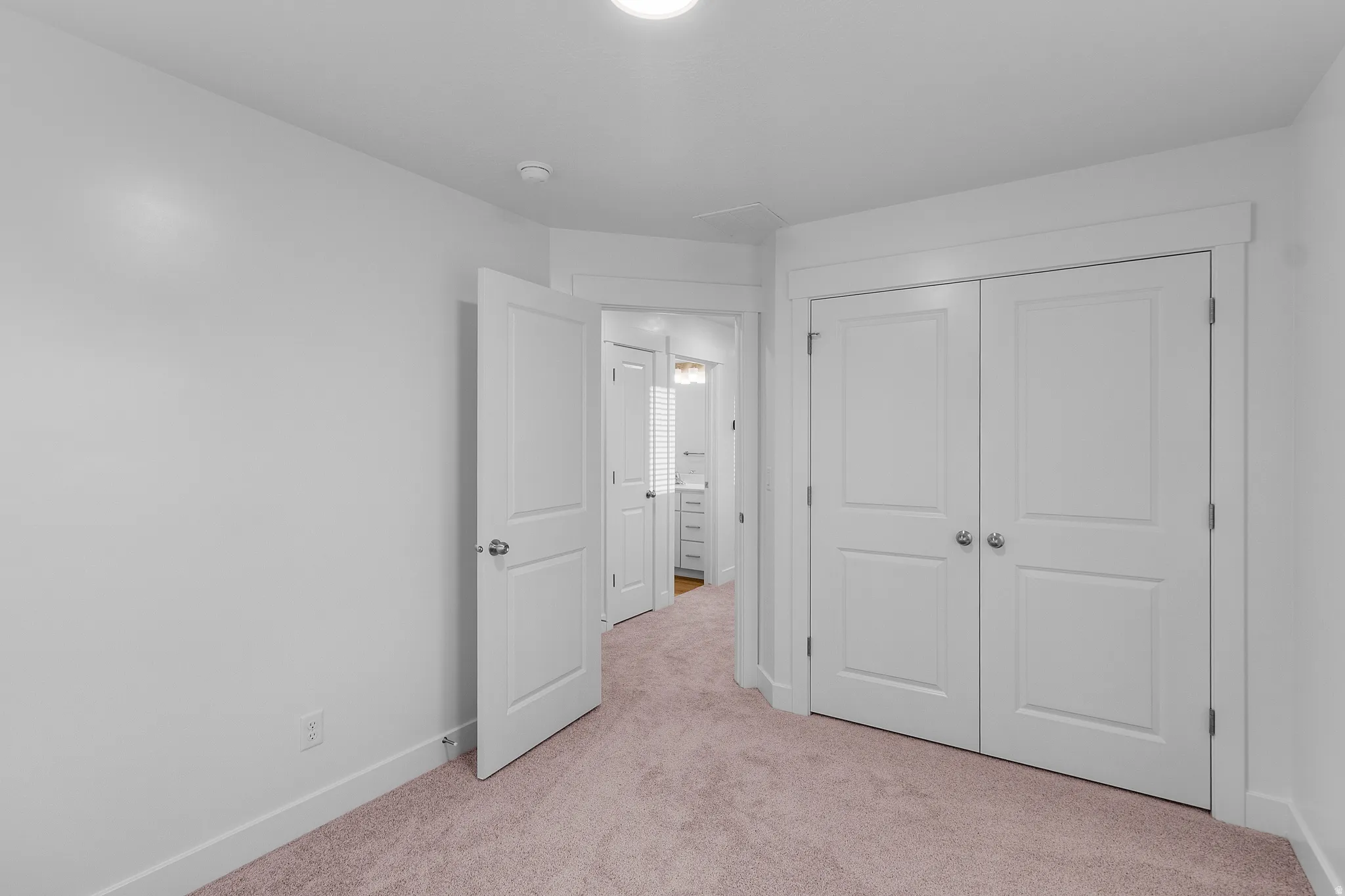 Room featuring neutral wall tones and a neutral carpeted floor