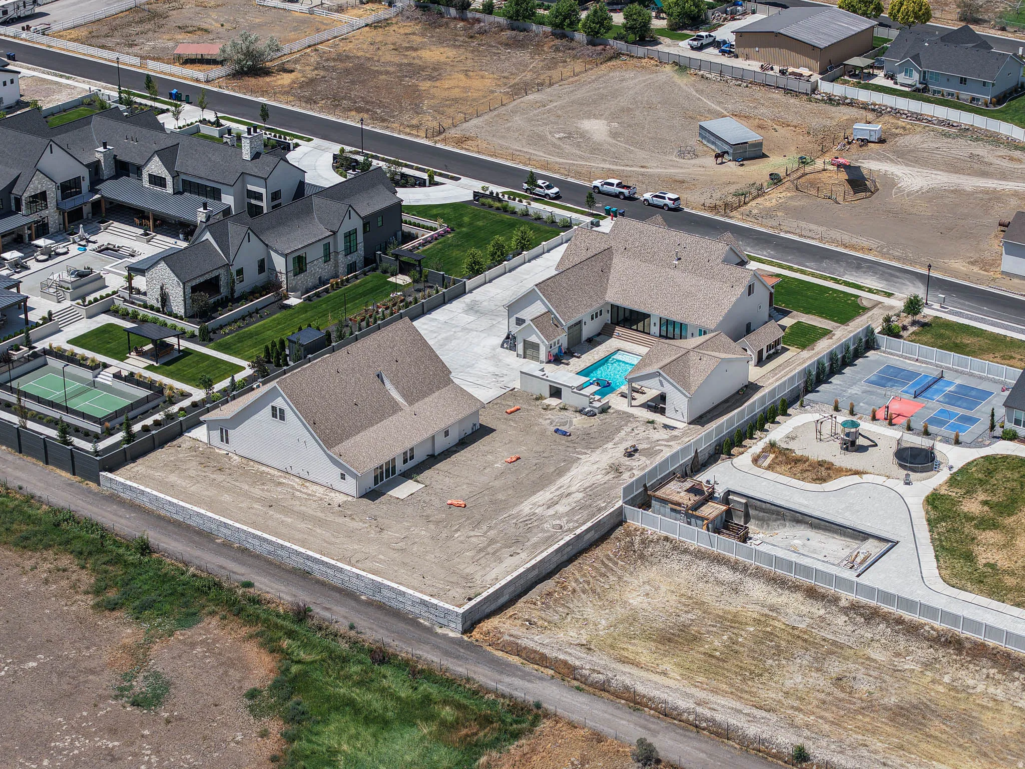 Expansive property featuring multiple structures and recreational amenities