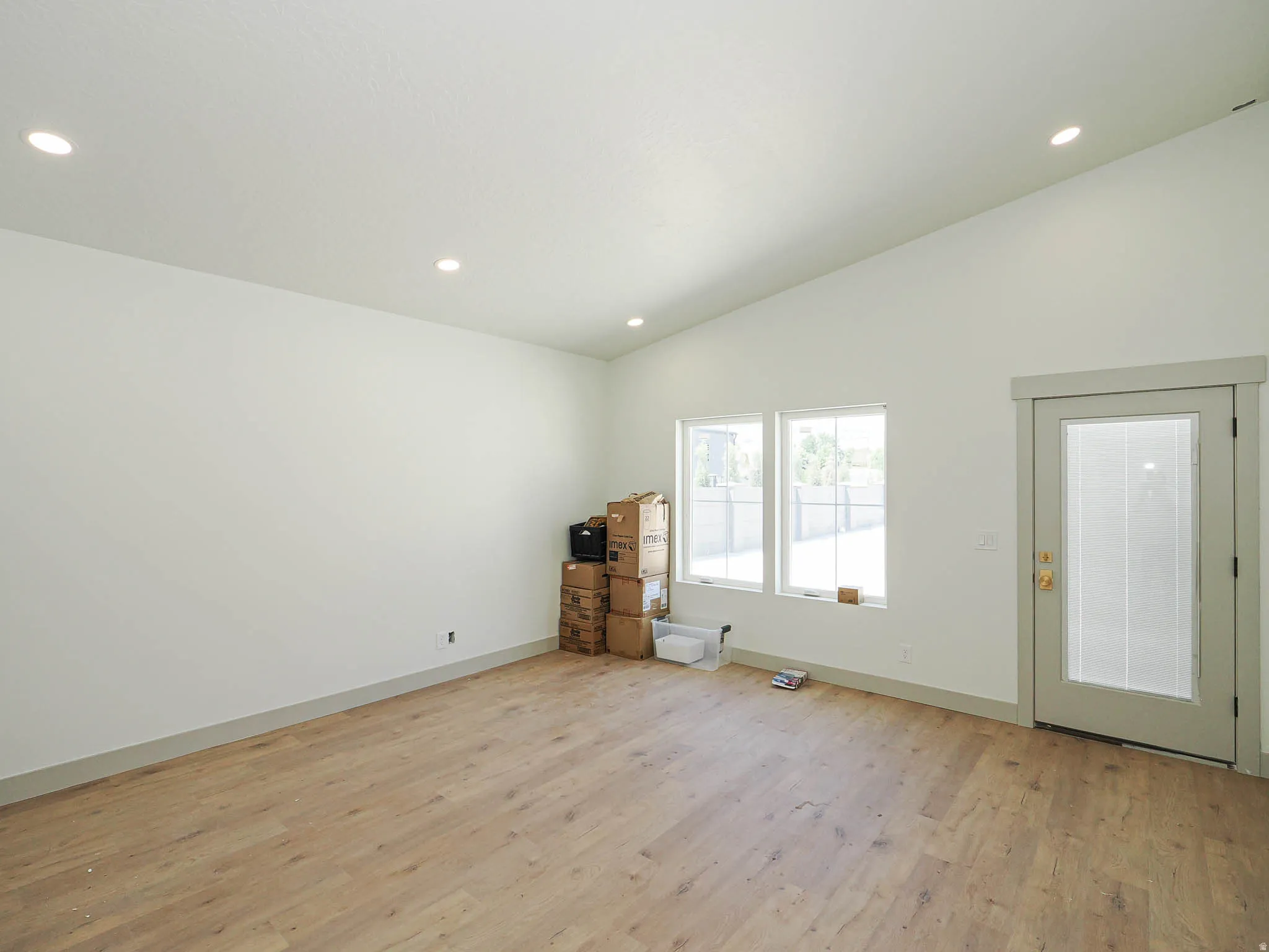 Vaulted ceiling featuring recessed lighting