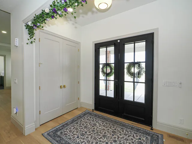 Double black French doors with clear glass panels