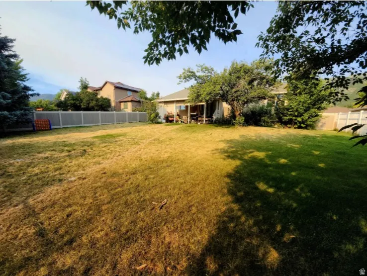 Back Yard is large and has covered private patio