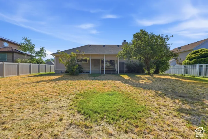 Expansive backyard , has access gate to Park in the back. No back yard neighbors/ featuring a partial-width covered patio, mature trees, and full-perimeter vinyl privacy fencing