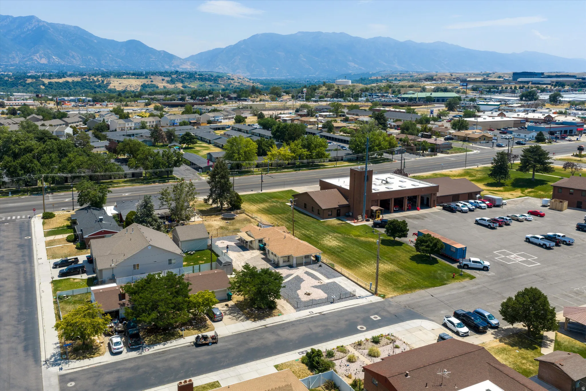 Aerial perspective showcasing residential properties and commercial structures