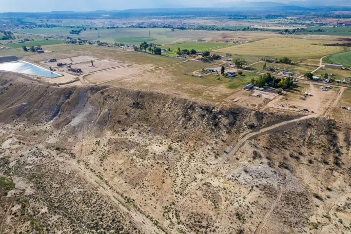 Expansive land parcel featuring diverse topography, including elevated plateaus and natural slopes