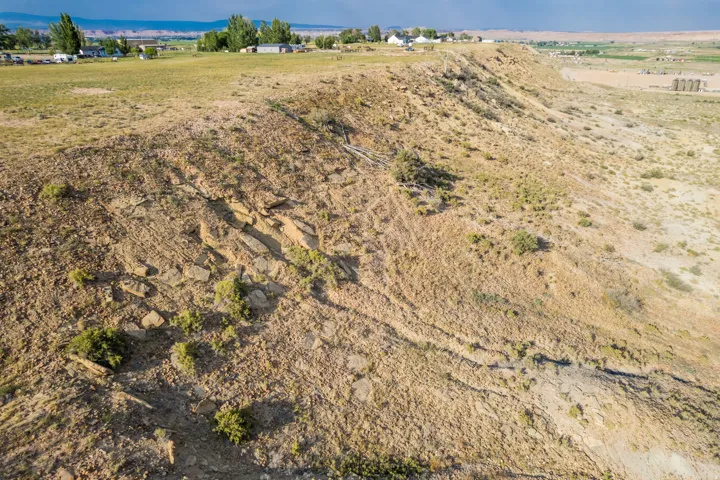 Expansive open terrain featuring natural rock formations and varied topography