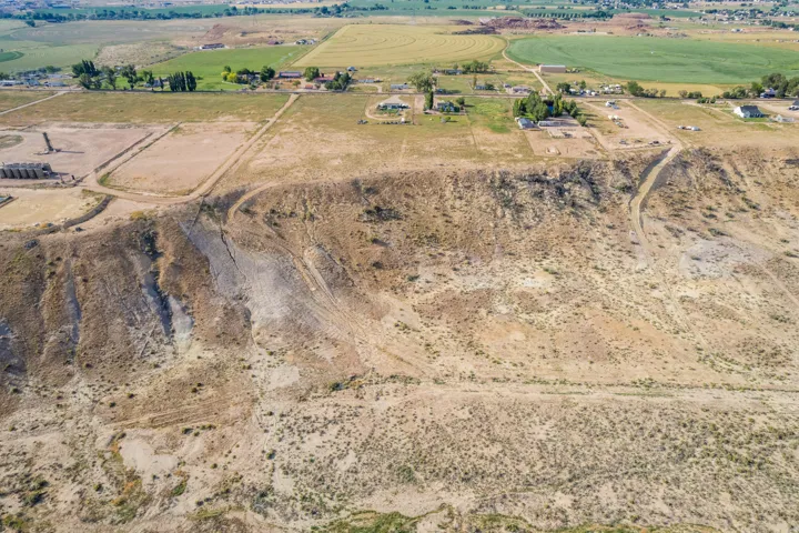 Expansive land offering significant development potential, featuring varied terrain including flat building areas and natural slopes
