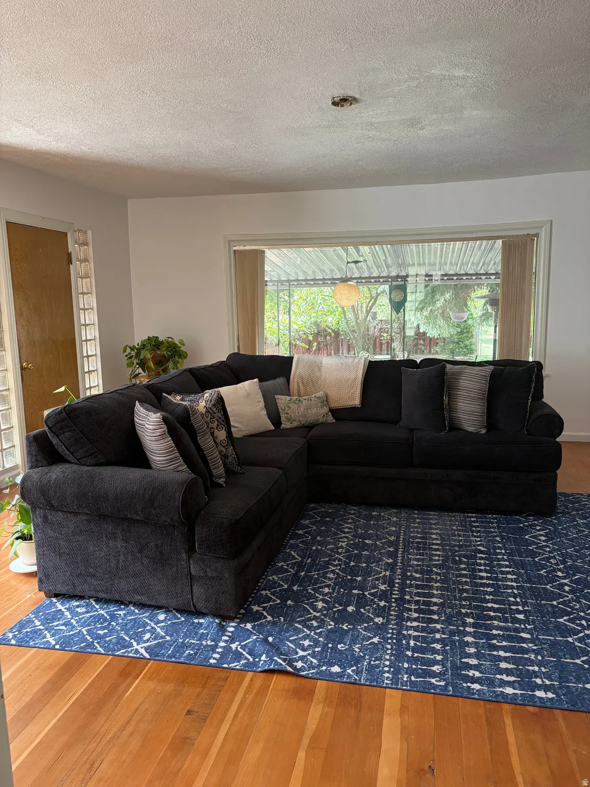 Wood-finish flooring with a large window